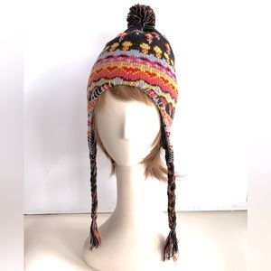 Festival Knit Hat with pom pom. Side Ties. Pink Yellow Black Floral pattern.